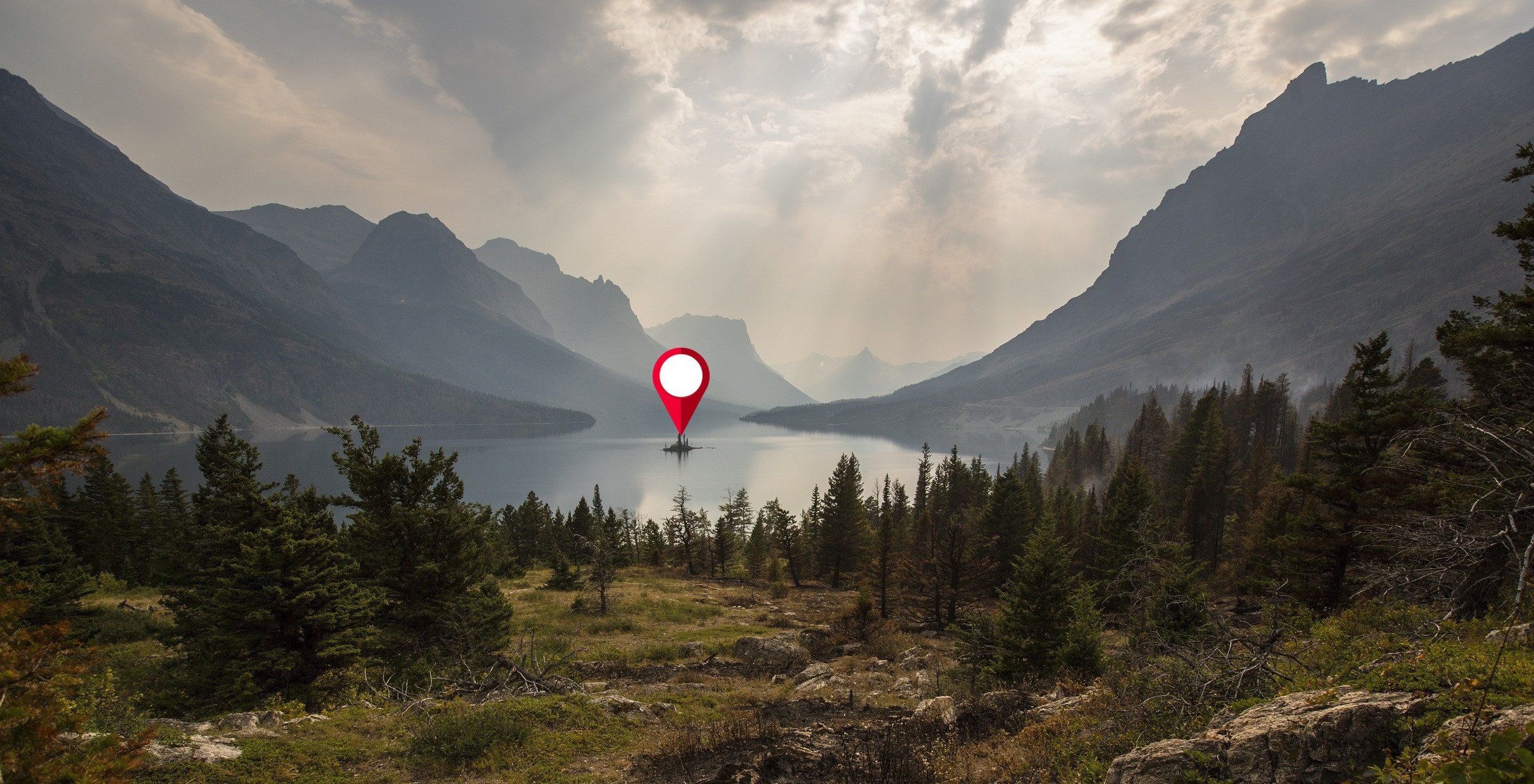A lonely island in the middle of a beautiful forest lake. A map pin location icon hovers above it.
