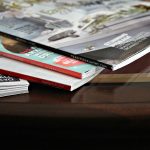 Stack of magazines laid out on a table