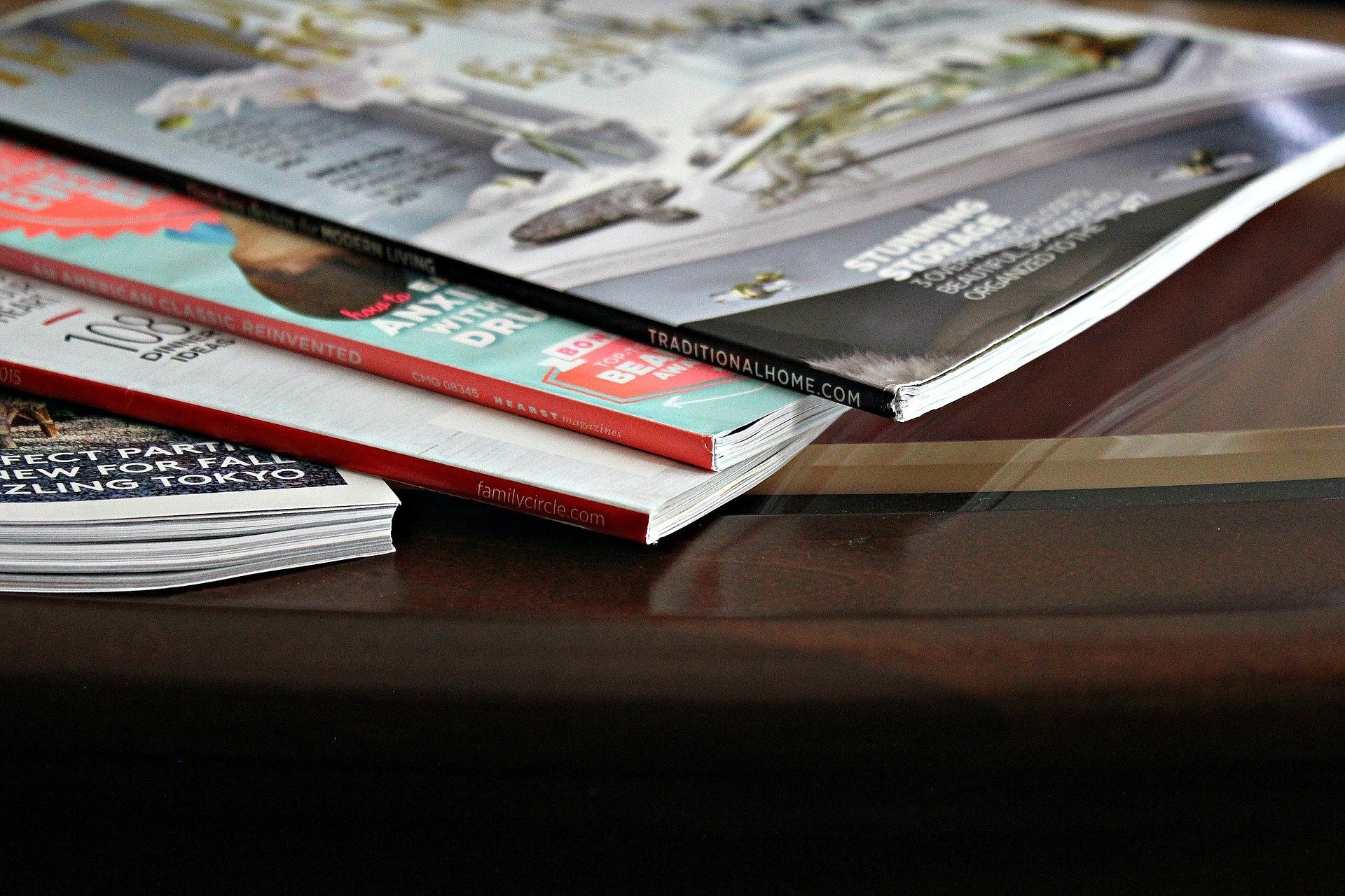 Stack of magazines laid out on a table